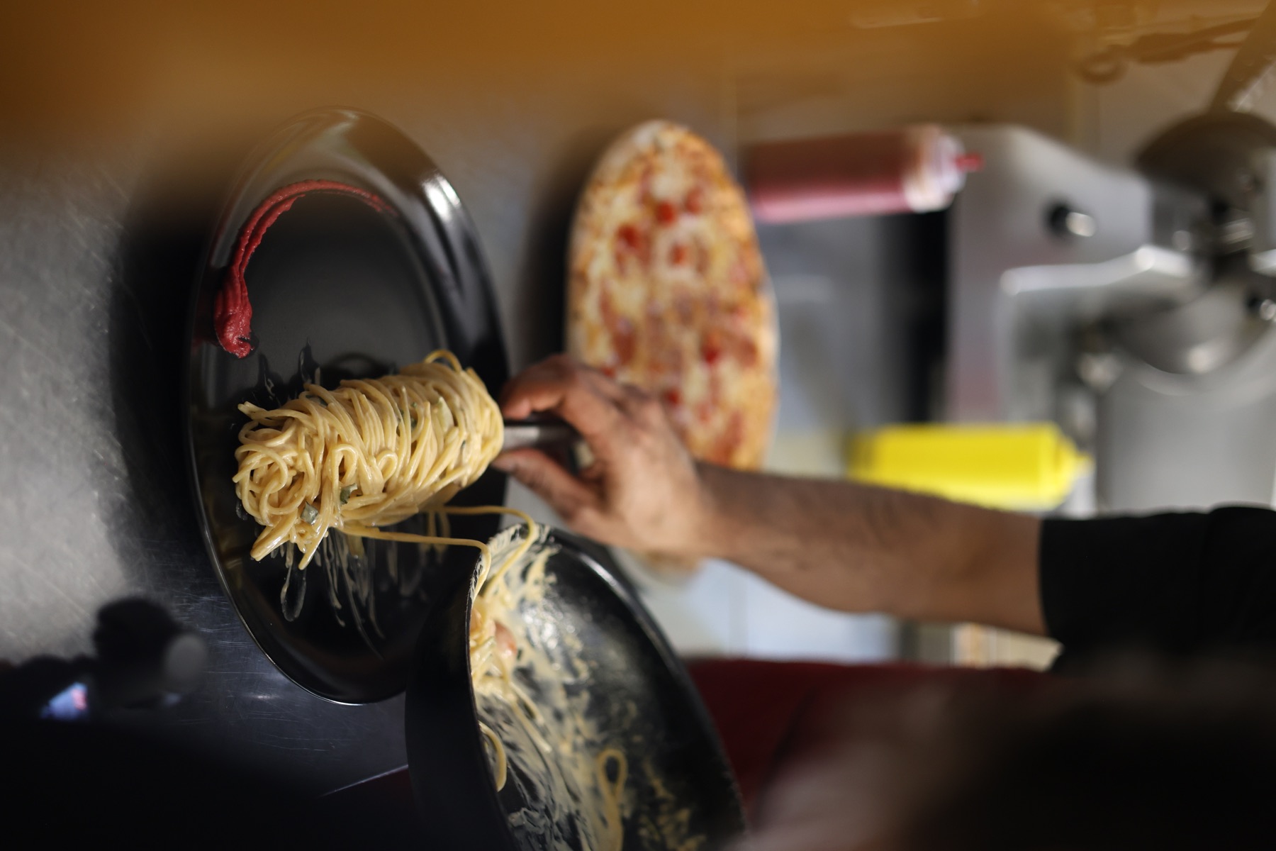 Fresh pasta being plated in the Gondelfahrt kitchen
